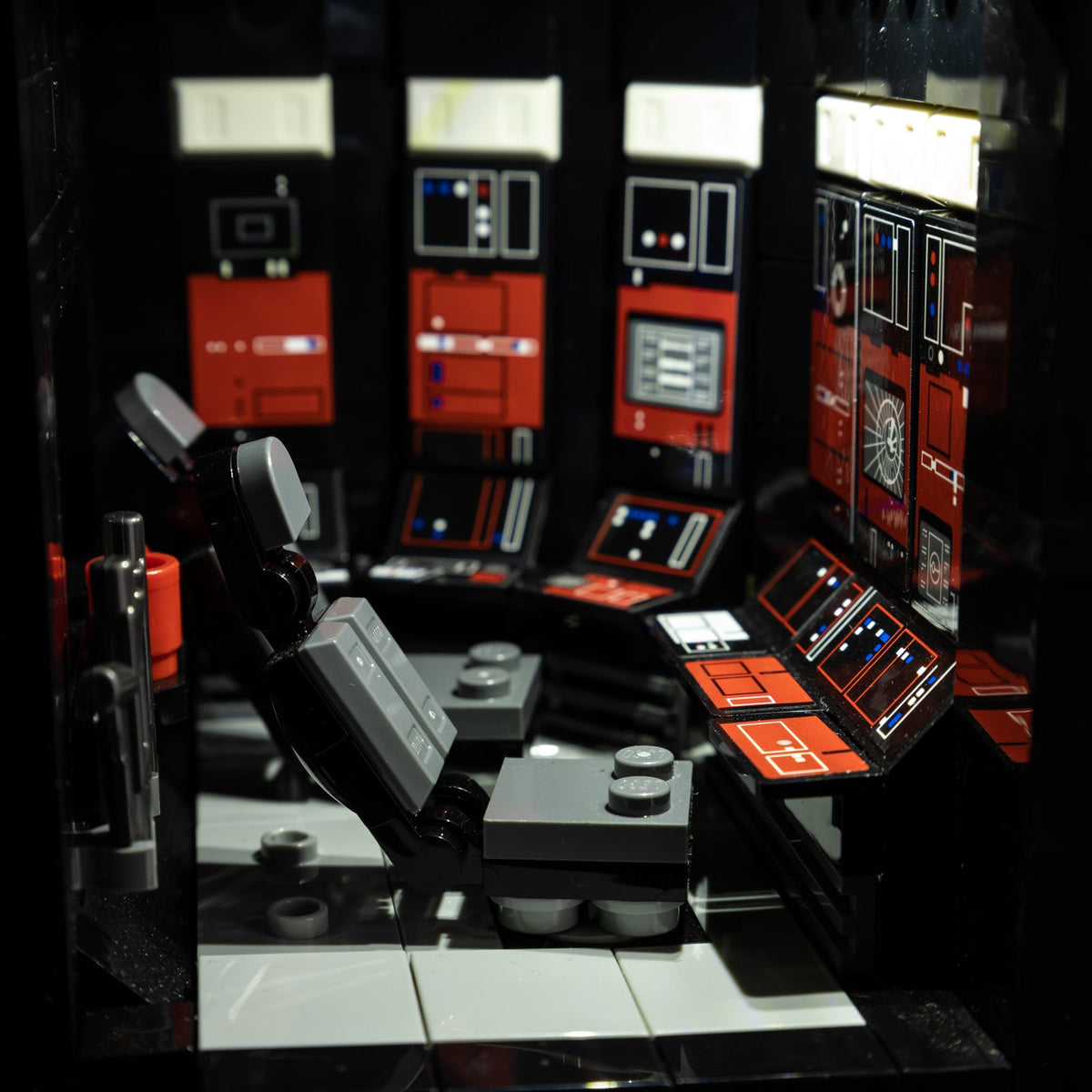 Close-up of the control area with red panels and bright screen details