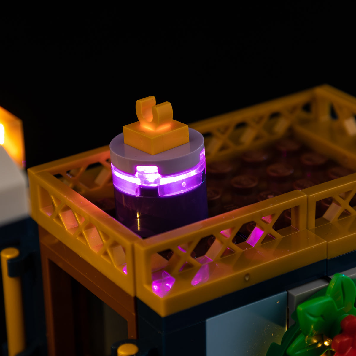 Purple light in the lantern inside the gold railing of the LEGO Holiday Express Train 10361 tender