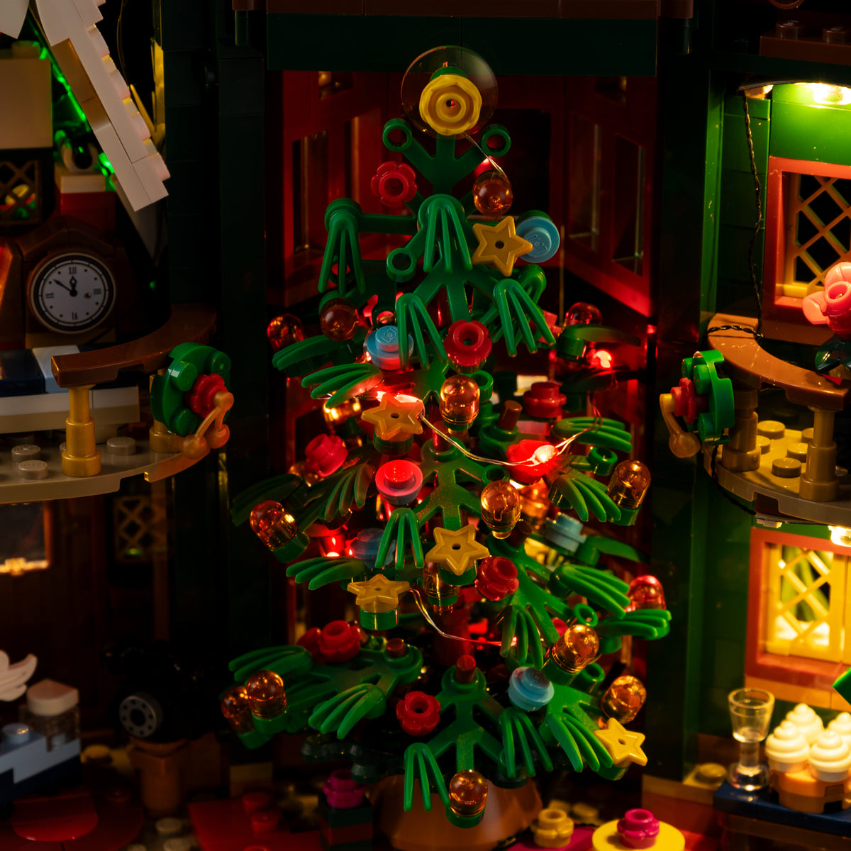 Existing red lighting photograph of the Christmas tree inside LEGO® Holiday House 11387.