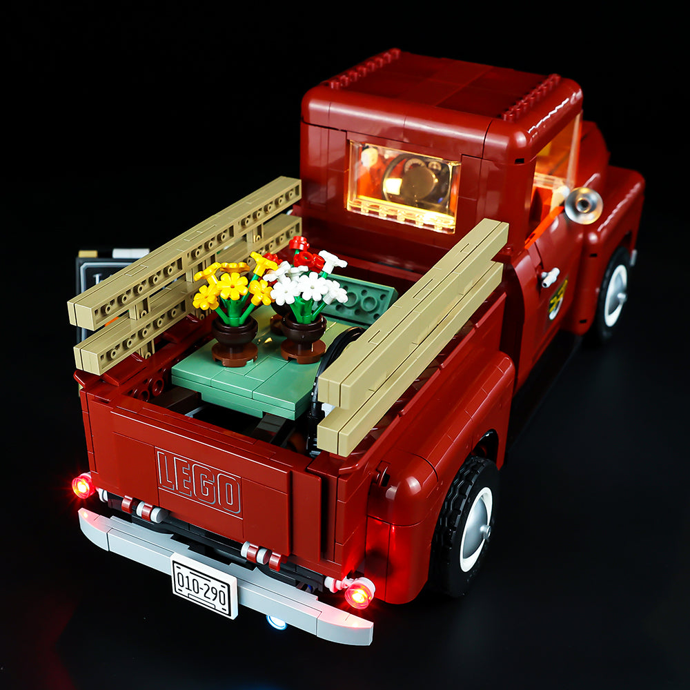Original Classic lighting photograph of LEGO Pickup Truck10290, rear view. Shared lighting and model geometry preserved.