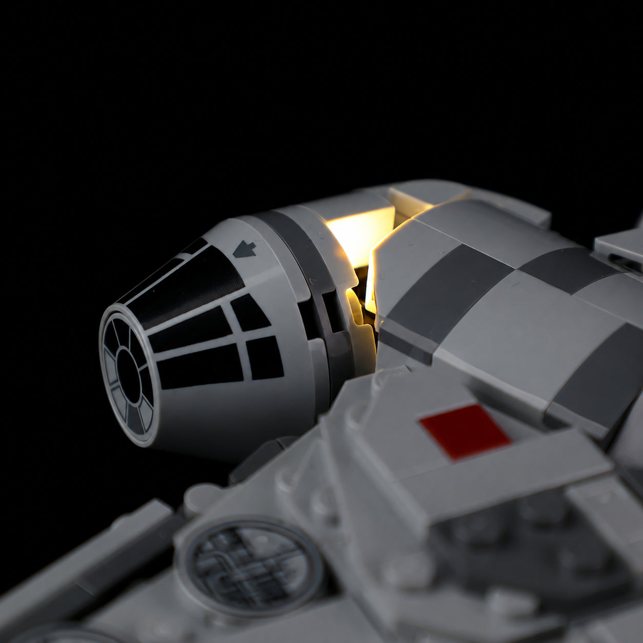 Warm light beside the Millennium Falcon cockpit