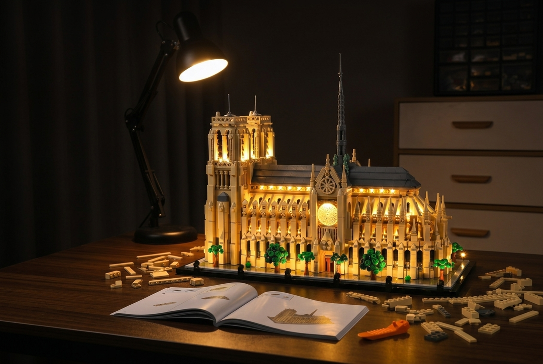 LEGO® Notre-Dame de Paris lit with a Game of Bricks LED Light Kit for LEGO® on a cozy builder's desk