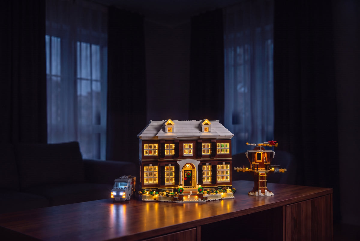 The same room after dark, LEGO® Home Alone 21330 lit with the Game of Bricks Christmas Edition light kit
