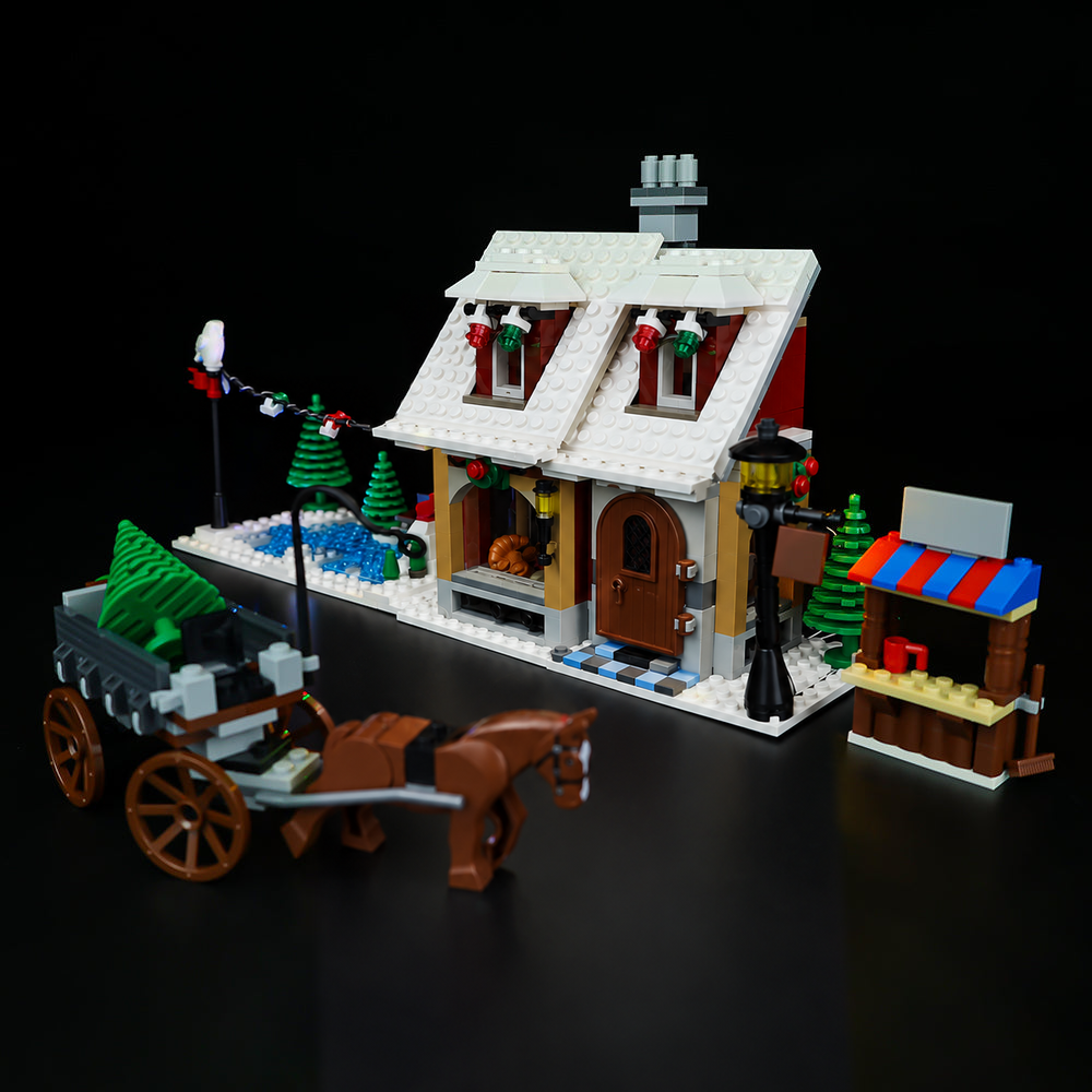 LEGO® Winter Village Bakery 10216 with Game of Bricks Lights switched off, matching the main product photograph.