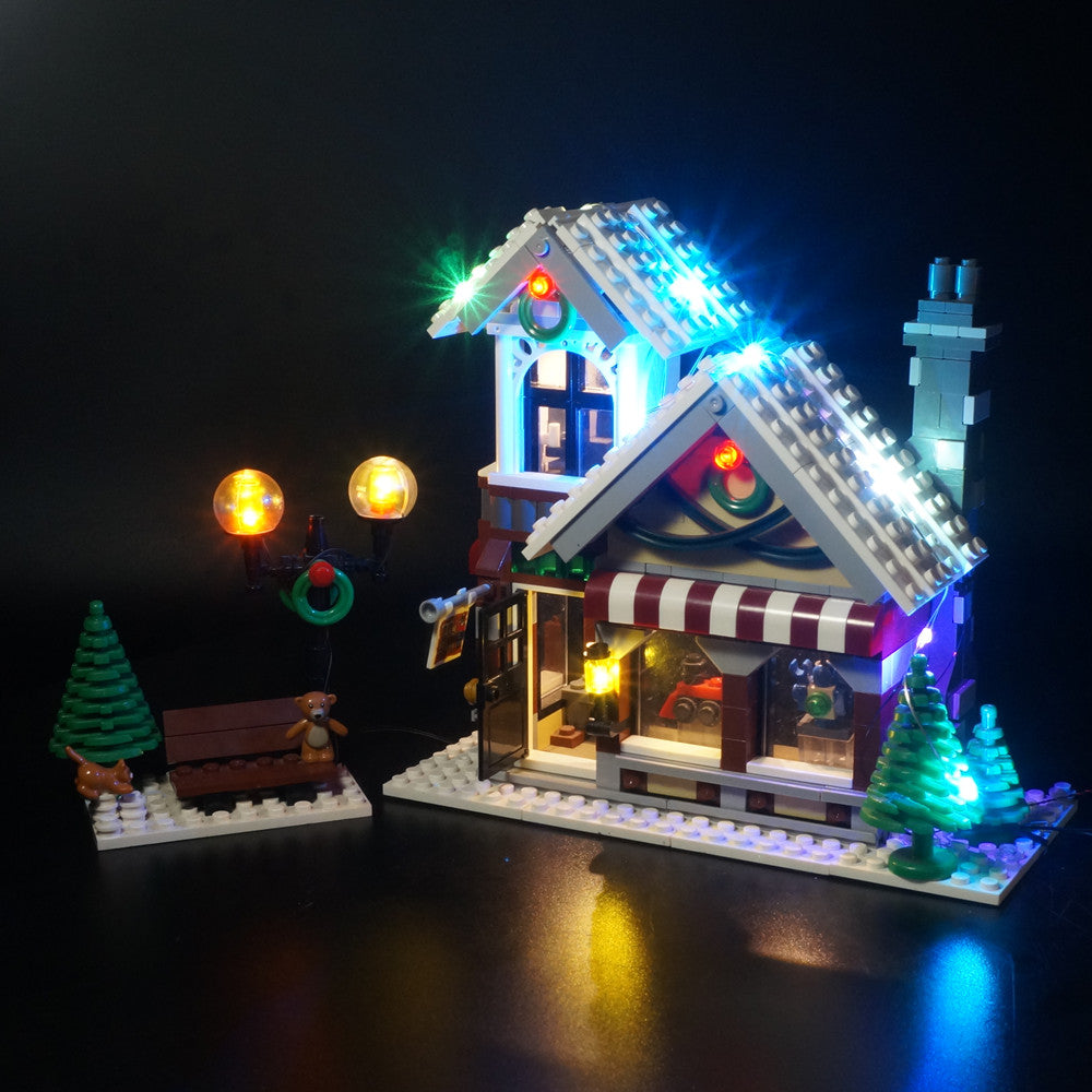 Light Kit for LEGO® Winter Toy Shop 10249 - front-quarter view of the toy shop and street lamps