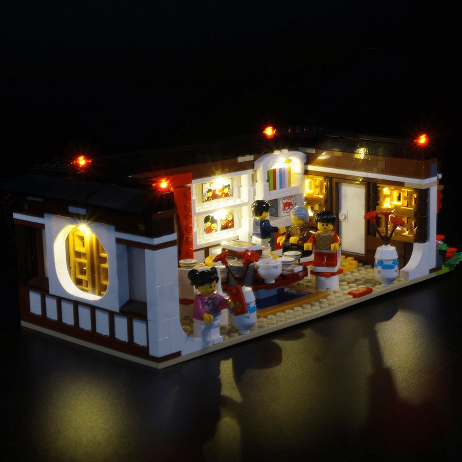 LEGO® Chinese New Year’s Eve Dinner 80101 with Game of Bricks Lights switched on, main product photograph.