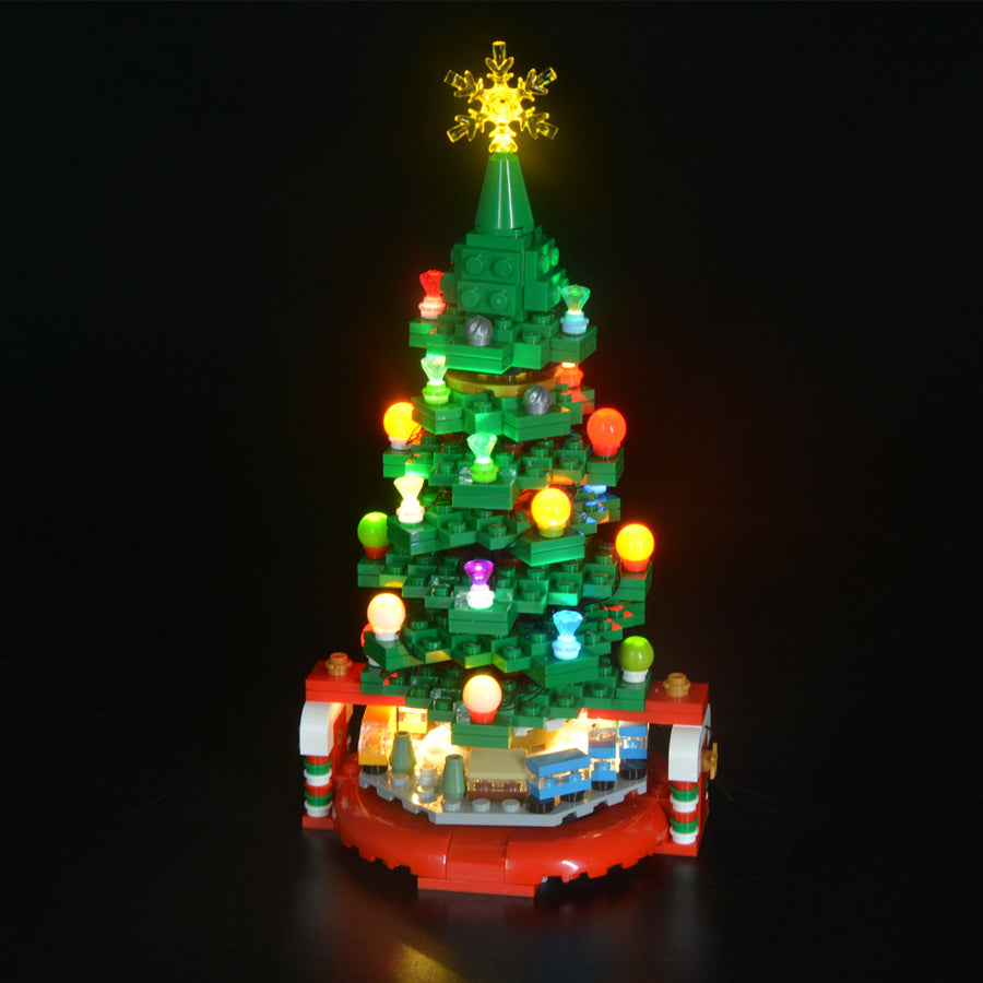 Light Kit for LEGO® Christmas Tree 40338 - front view of the illuminated tree and tiny train