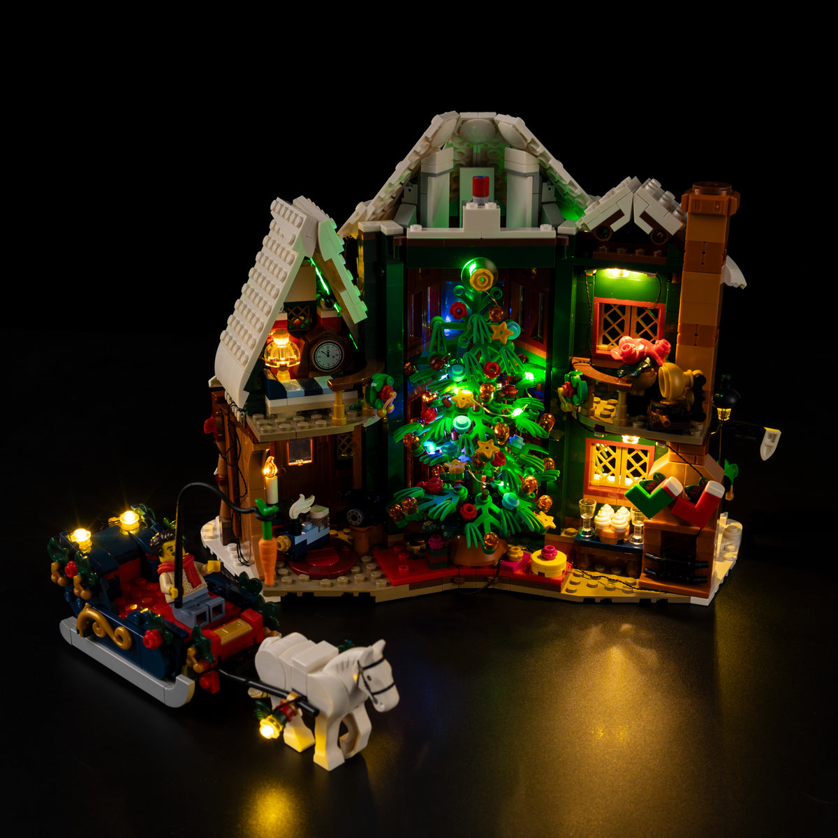 Warm interior lighting through the windows of the Light Kit for LEGO® Holiday House 11387