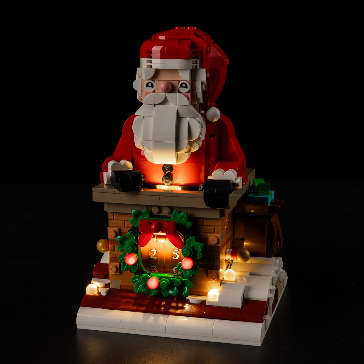 The real LEGO® Santa’s Holiday Countdown 40874 with the Game of Bricks light kit, seen from the front quarter.